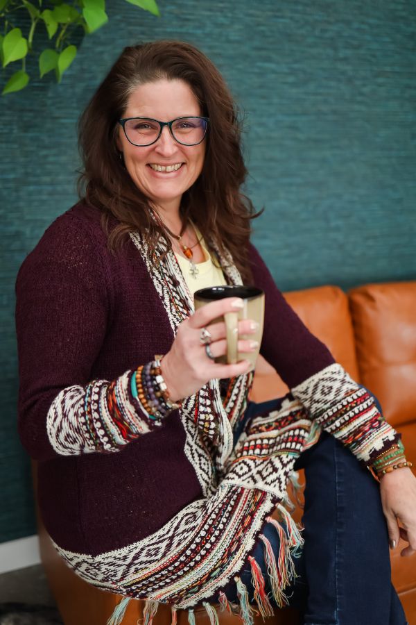 lisa with coffee sitting on couch